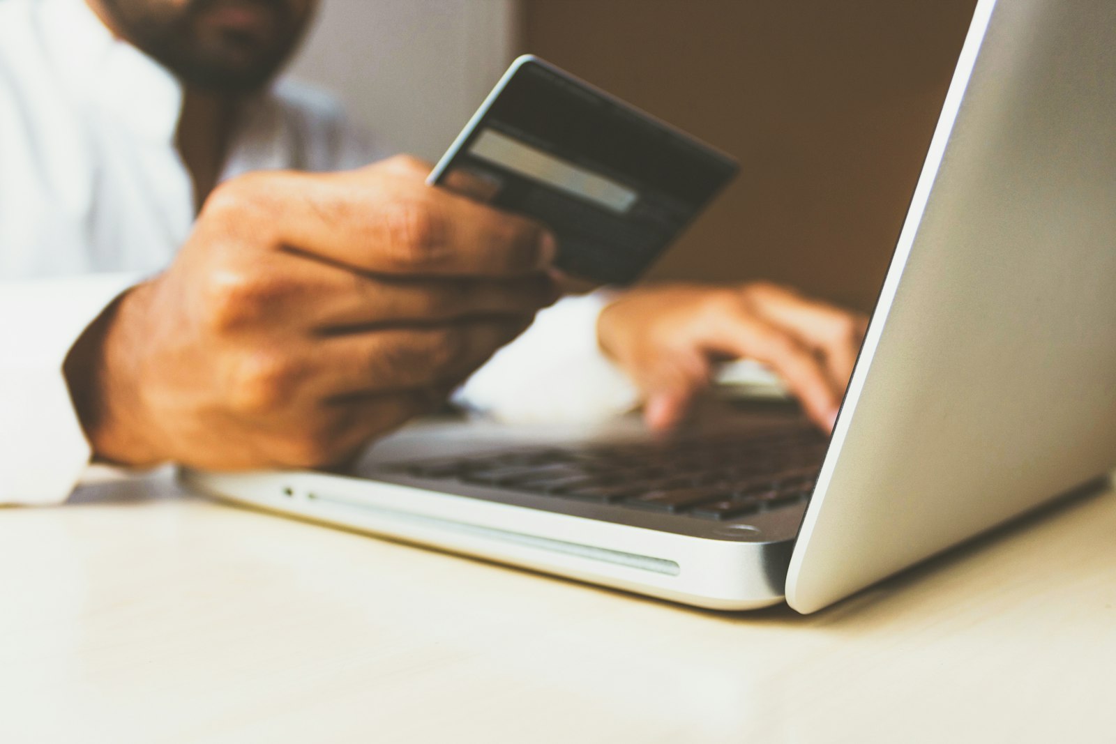 Entering card details on a laptop
